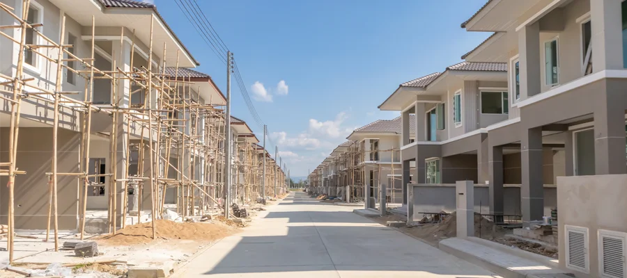 Residential construction site with new homes under development, featuring scaffolding and unfinished structures, reflecting Ibarra Construction's focus on high-quality building services in Woodland, CA.