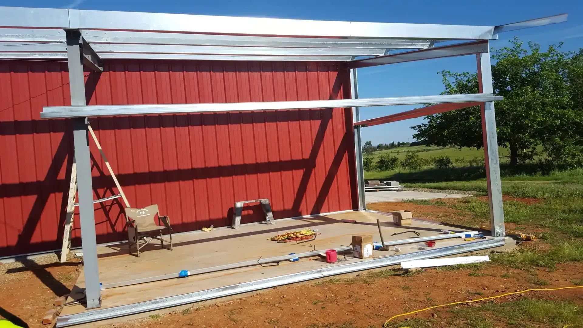 Red iron steel building showcasing weather resistance during a storm