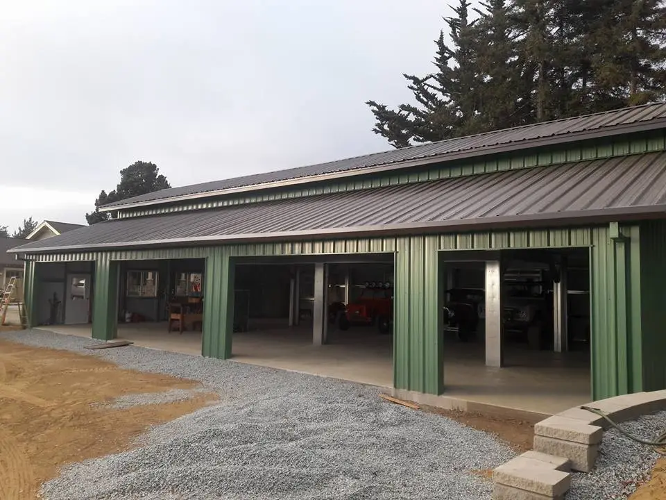 Custom metal building with clear-span bays and garage doors for flexible layout and storage.