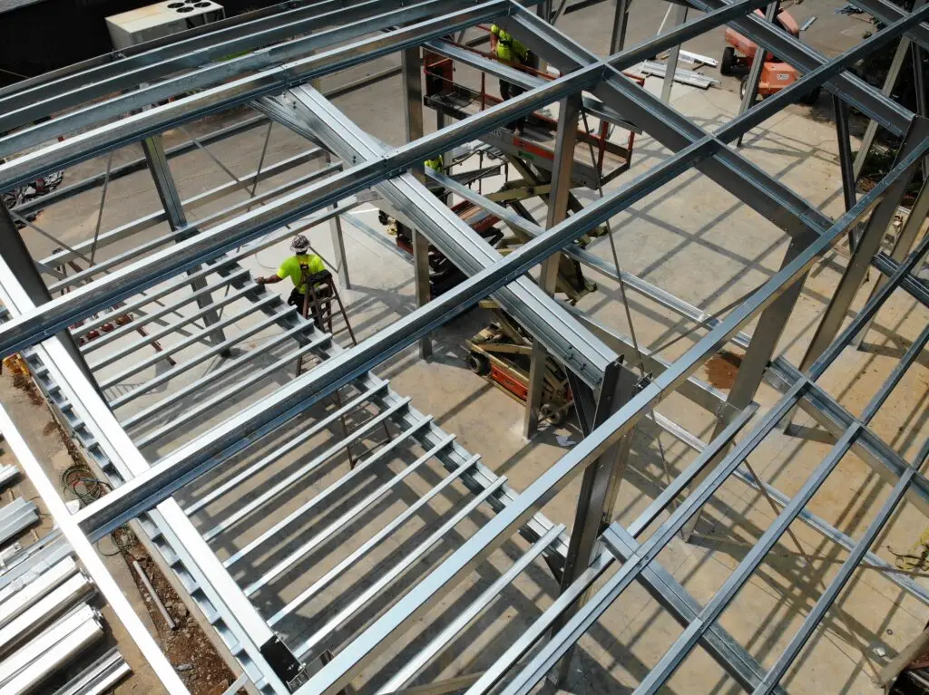 Construction site with metal buildings highlighting the theme of hidden fees in construction services
