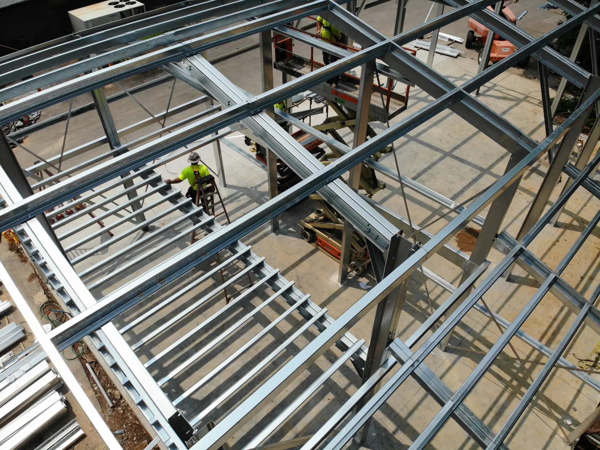 Construction site with metal buildings highlighting the theme of hidden fees in construction services